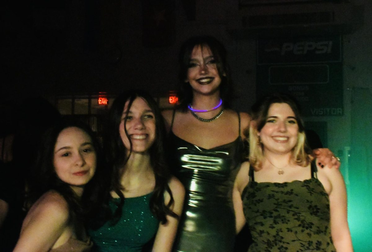 Friends take the time to snap a picture at Homecoming.