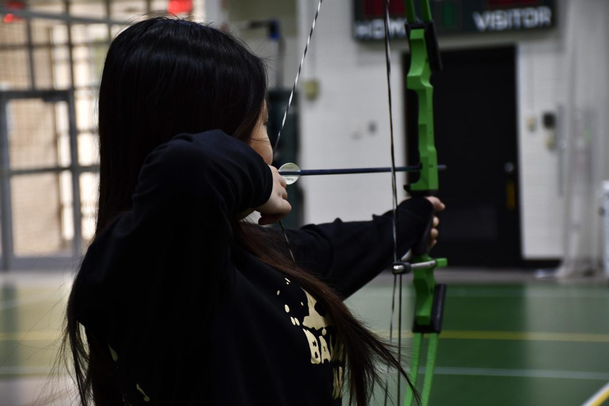 Grier girl practicing archery