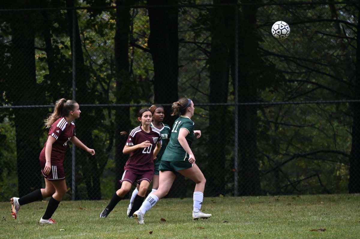 Captain, Angelena Mack, '27, chases after a ball during the game