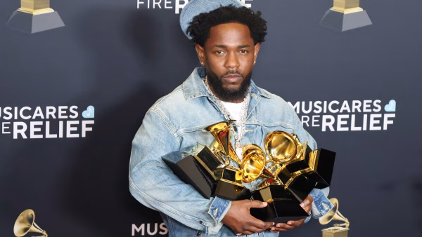 Kendrick Lamar with past Grammys, 2025