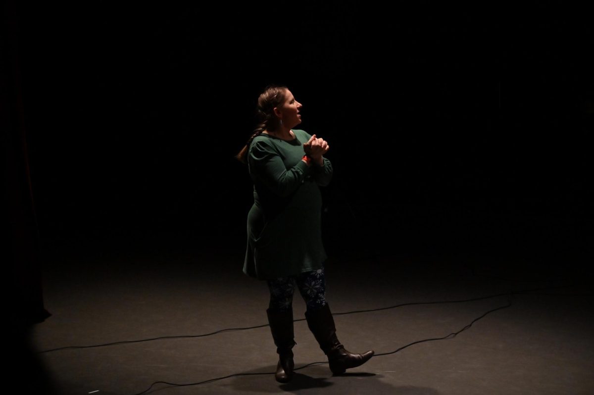 Dr. Erin Guydish Buchholz introducing Grier girls to the host and singers of the Dr. Martin Luther King Jr presentation