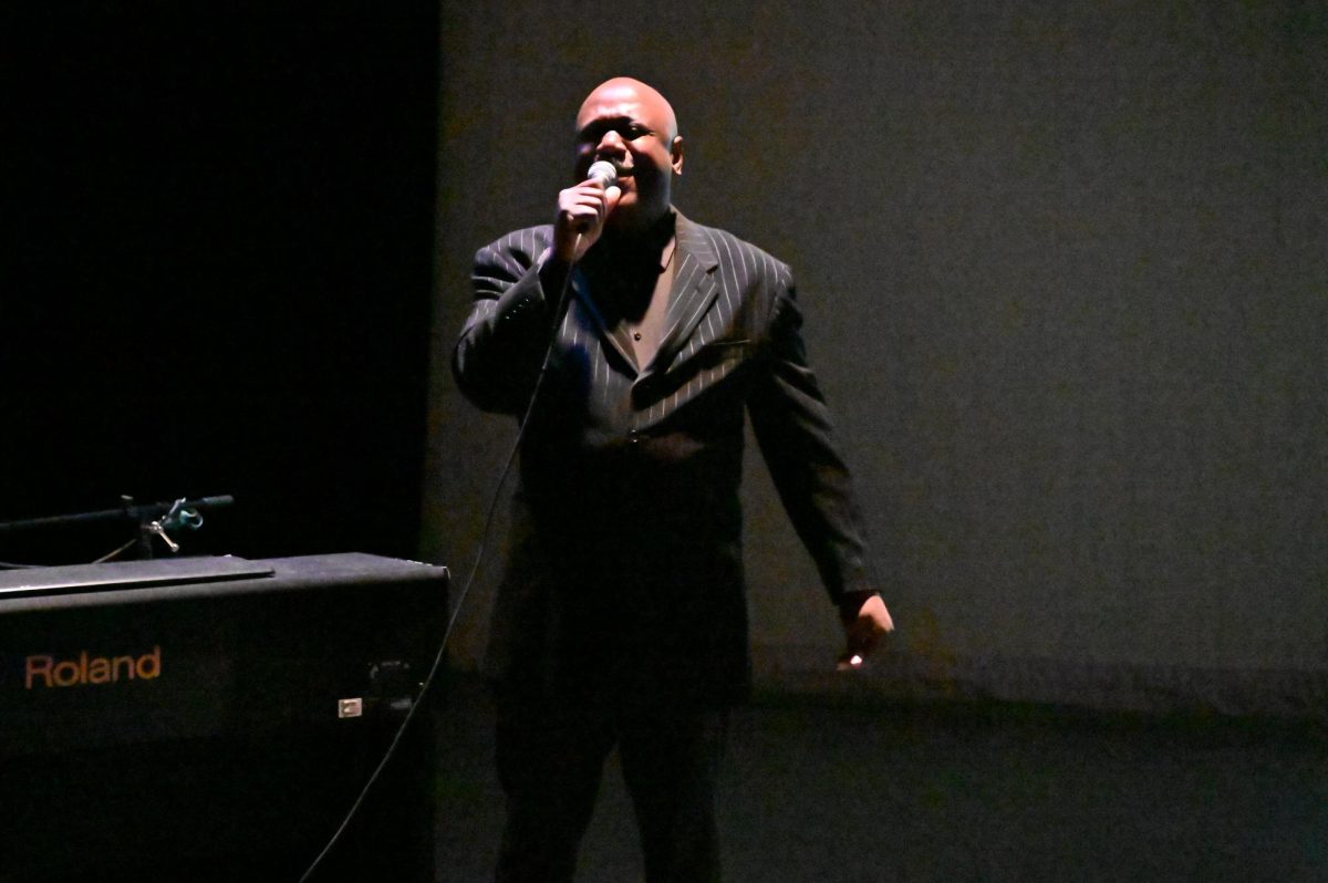 The host of the MLK Jr presentation inviting the crowd to sing along!