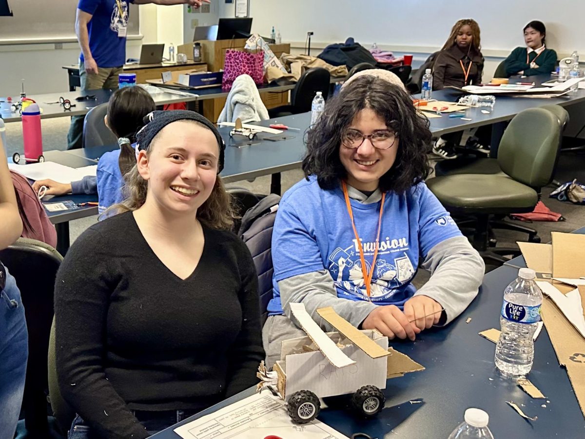 Grier girls Pia Rock 27' and Amalys Zahrouni 27' creating a truck at an NSTEM event!